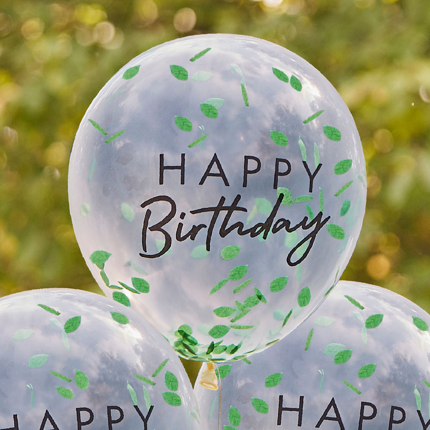 ballons Happy Birthday transparents avec confettis feuilles vertes